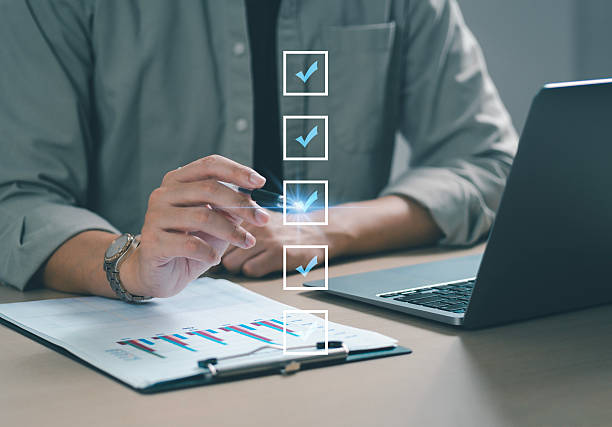 istock Businessman doing online survey and digital form checklist on virtual screen. Document management system, online document database, digital document icon and online document approval. 2234238229