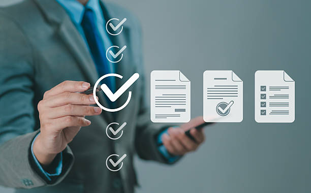 istock Businessman conducting online surveys and digital form checklists on a virtual screen, document management system, online document database and file management process. 2234238242