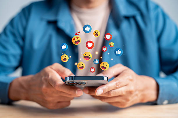 istock Digital content and engagement concept. Man using smartphone with social media interaction, online feedback, and emotional expression in mobile communication. 2234238675