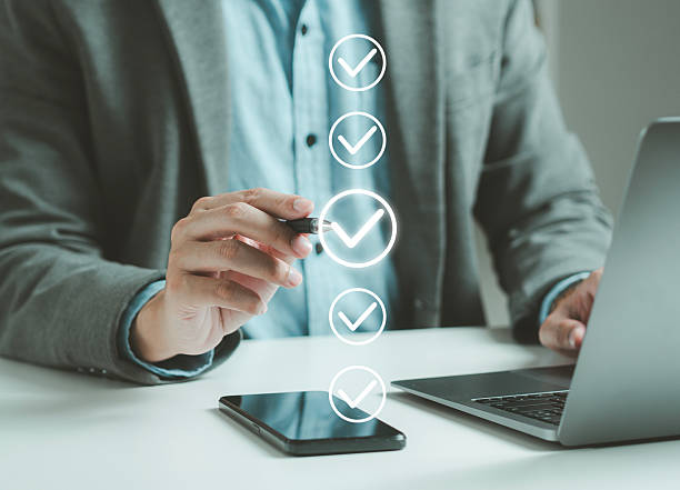 istock Businessman doing online survey and digital form checklist on virtual screen. Document management system, online document database, digital document icon and online document approval. 2234238828