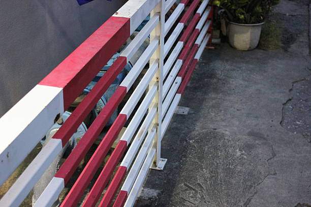 red an white street railing