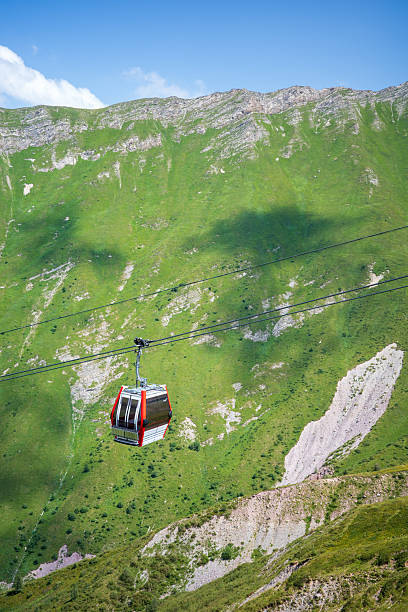 istock Red Cable Car in Mountain Landscape under Blue Sky 2234242140