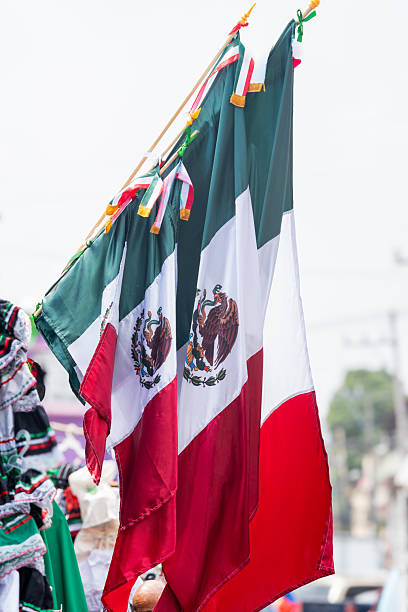 istock Three flags with the Mexican flag in the middle, Mexican independence day ornaments 2234242449