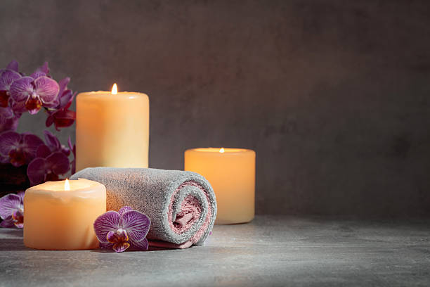 istock Towels, orchid flowers, and burning candles. 2234242887