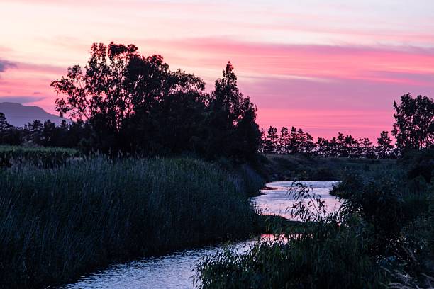 istock Serene River Sunset with Vibrant Skies 2234242965