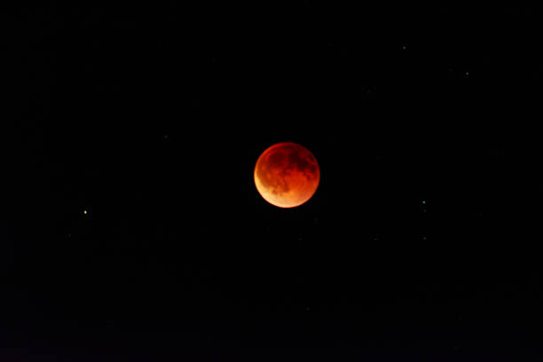 istock Red blood moon during total lunar eclipse at night sky Blood moon 2234249955