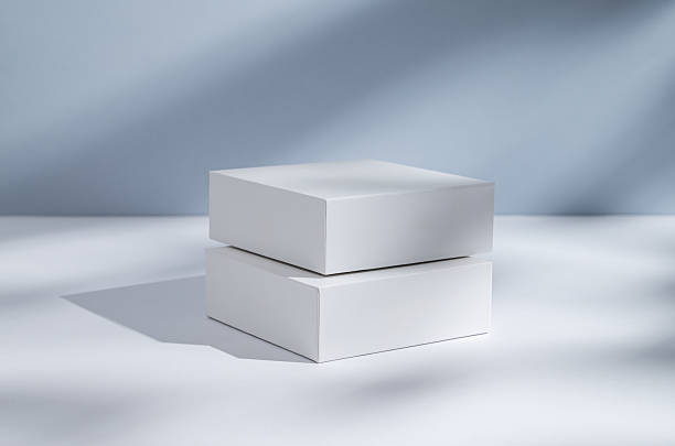 istock Two white cubes, boxes or podium on a blue  background with shadows. 2234250734