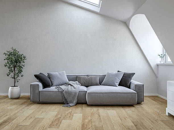 istock Front view of a Bright Scandinavian Loft Interior with Roof windows (skylight), sloped ceiling, Cozy Sofa and Decorative Cushions 2234251826