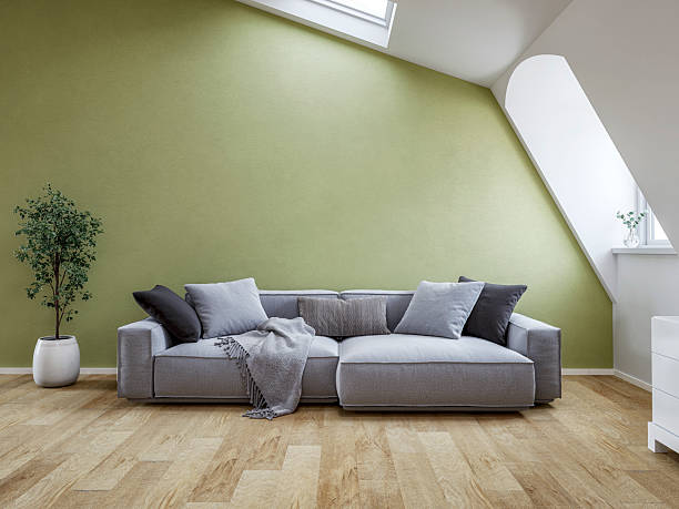 istock Front view of a Bright Scandinavian Loft Interior with Roof windows (skylight), sloped ceiling, Cozy Sofa and Decorative Cushions 2234251838