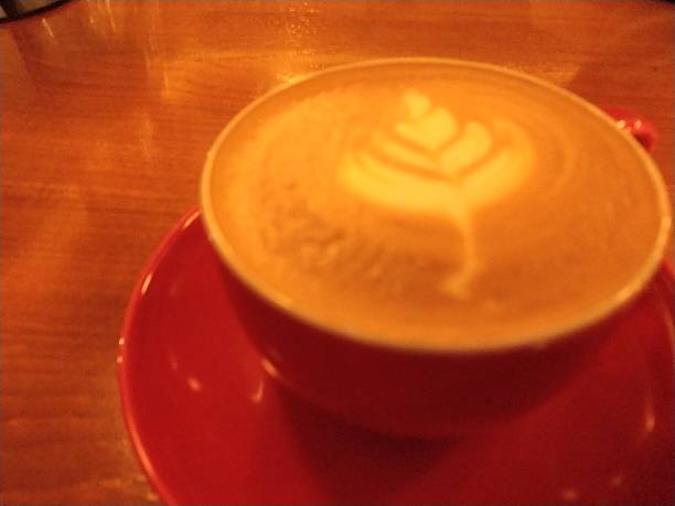 Hot cappuccino drink with art late close-up view