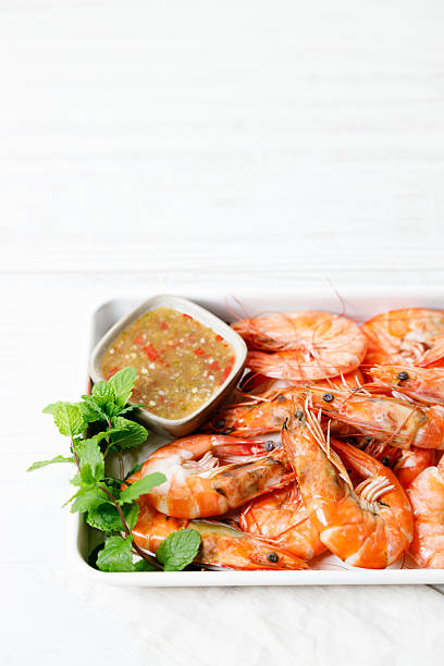 istock Grilled shrimps with spicy sauce in a white tray. 2234254191