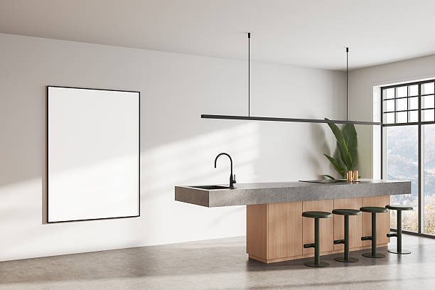 istock Modern kitchen interior with blank poster mockup on white wall and minimal island design in natural daylight setting. 3D Rendering 2234254338