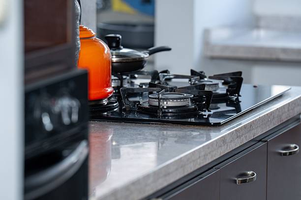 istock A kitchen with gas stove, orange kettle, and cooking pot 2234254691