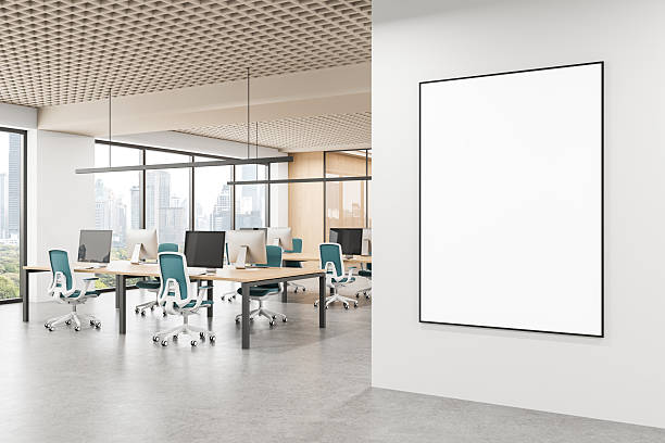 istock Modern office interior with large blank poster mockup on wall near open workspace and city view through glass windows. 3D Rendering 2234255767