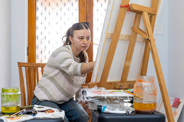 istock Young woman painting 2234258740