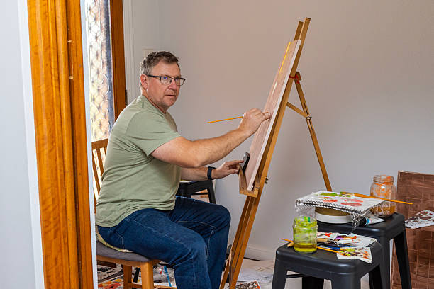Senior man painting a picture