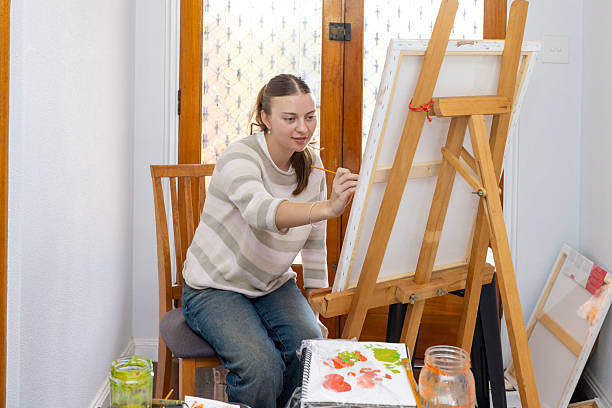 istock Young woman painting 2234258751