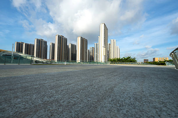 The urban skyline is characterized by smooth residential buildings and spacious city squares