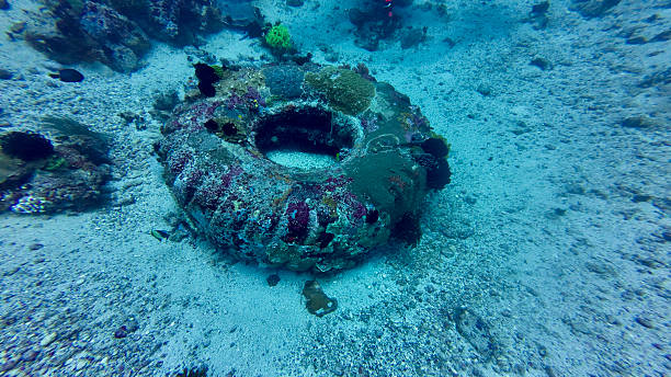 istock A car tire underwater on the seabed. 2234261420
