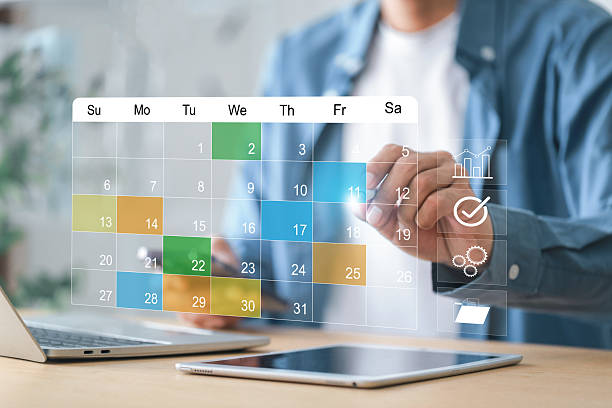 istock Calendar time management concept. Businessman using calendar meeting  marking note target appointment  and planing schedule 2234264035