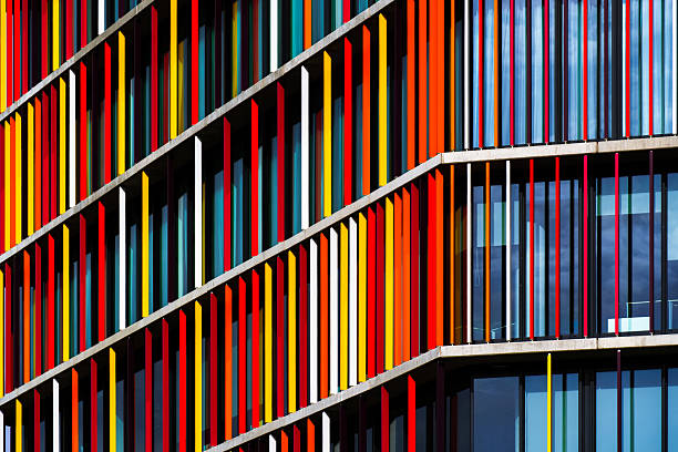 istock Vibrant office building facade with colorful vertical panels creating rhythm, contrast, and dynamic architectural composition. 2234265173