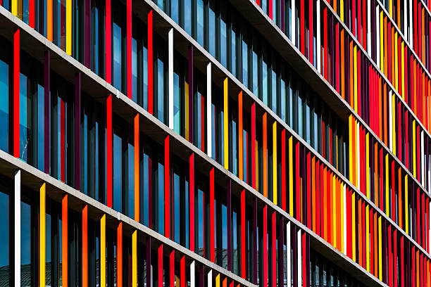 istock Vibrant office building facade with colorful vertical panels creating rhythm, contrast, and dynamic architectural composition. 2234265277