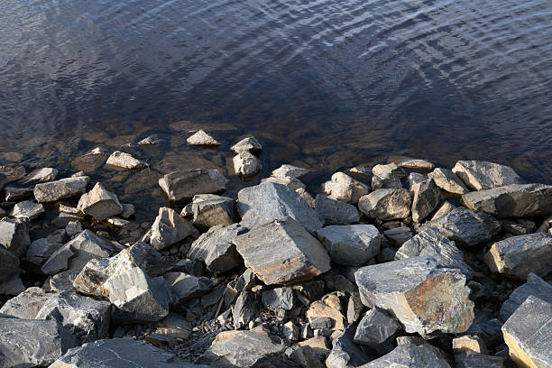 istock Breakwater made of stones along the seashore 2234268899