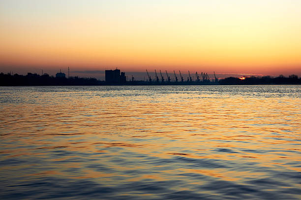 istock View over the Danube river at port cranes at winter sunrise 2234271655