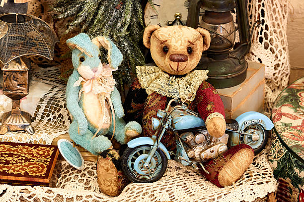 Toy teddy bear, bunny and motorcycle. Cafe decor