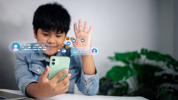 istock Happy boy using smartphone for social media live streaming, online communication and digital lifestyle 2234272358
