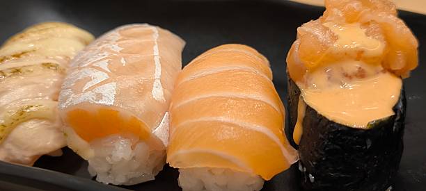 istock Sushi on a black plate on a wooden table 2234274745