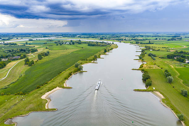 istock Ship on the river Lek river with rain clouds above 2234275105