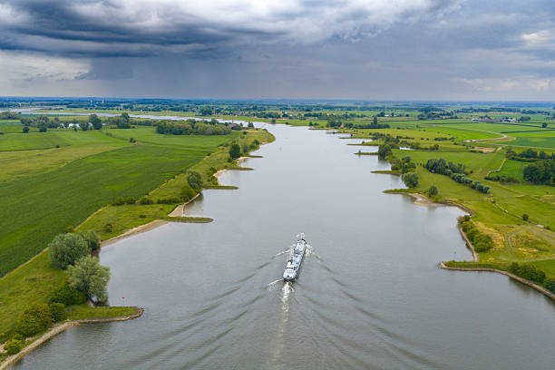 istock Ship on the river Lek river with rain clouds above 2234275138
