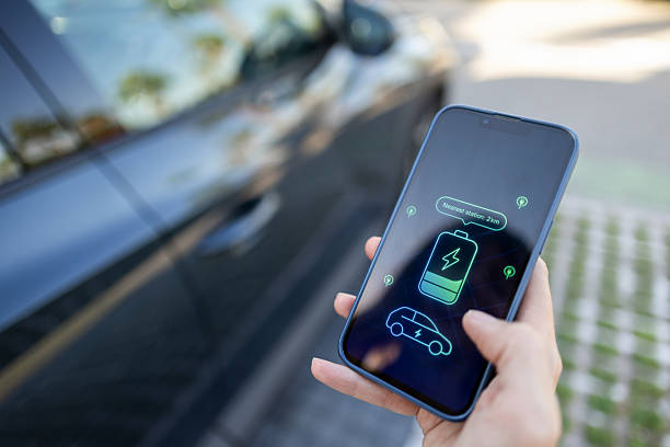 istock Driver using smartphone app to find nearest electric vehicle charging station 2234281073
