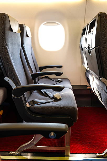 istock Empty window seats inside commercial passenger plane, no people, wide angle view, window light 2234281868