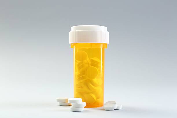 istock Medical bottle with antibiotic pills on grey background 2234282245