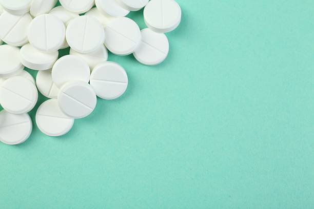 istock Pile of antibiotic pills on turquoise background, top view. Space for text 2234282301