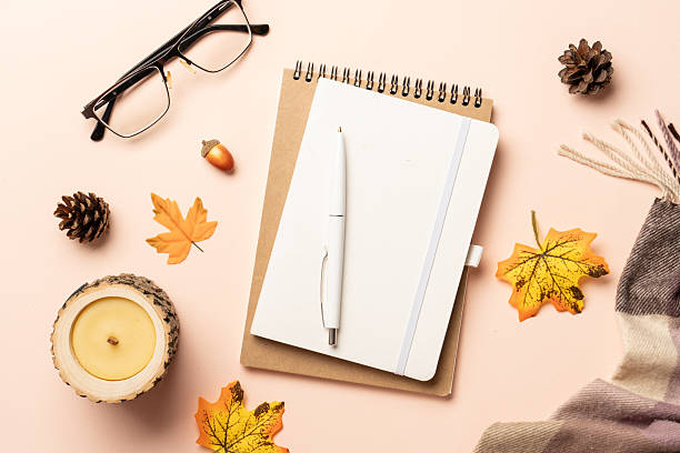 istock Notebook, pen, glasses and scarf with yellow leaves. 2234282930