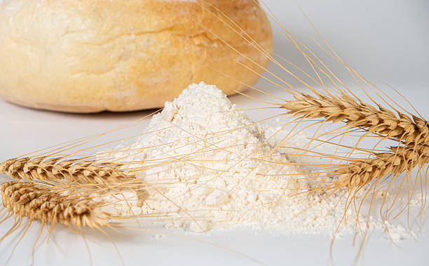 Freshly Baked Bread with Wheat Ears and Flour Close-Up