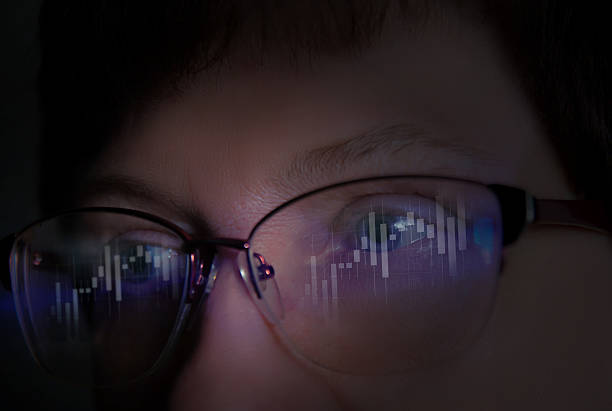 istock Person analyzing cryptocurrency market trends through digital data displayed on glasses at night 2234283467