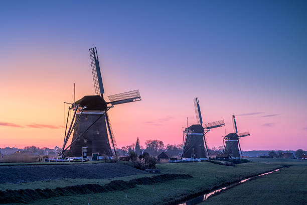 istock Three Windmills at Sunrise in Stompwijk 2234284117