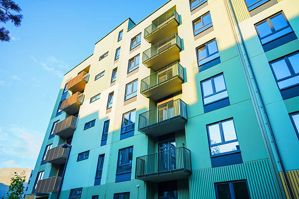 istock New Apartment facade. Modern residential facade with balcony, windows. 2234284208