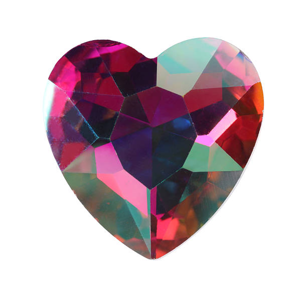istock Colorful heart shaped shiny gemstone isolated on white 2234285110