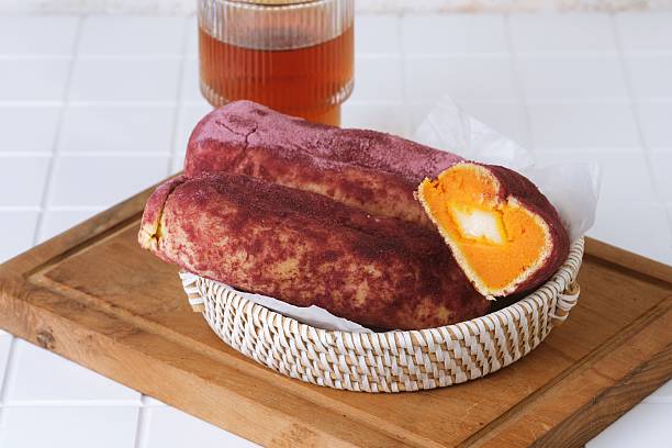 Fresh baked Goguma Ppang bread with rustic presentation on table.