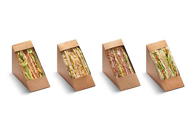 Cut club sandwich in cupboard package isolated on white background