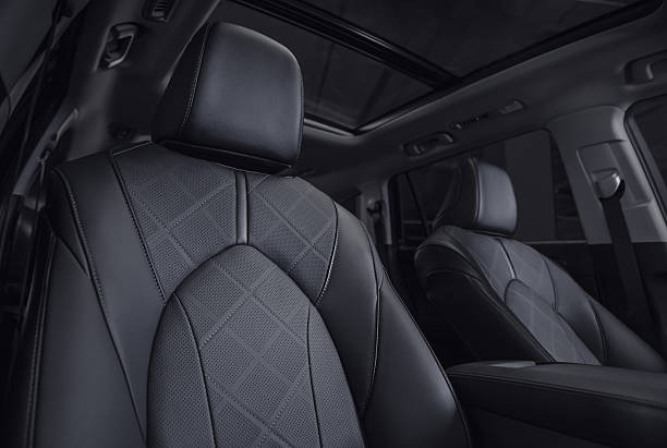 istock SUV interior with rows of leather seats at night. 2234288475