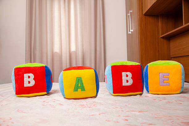 Baby Stacking Colorful Blocks on Wooden Floor