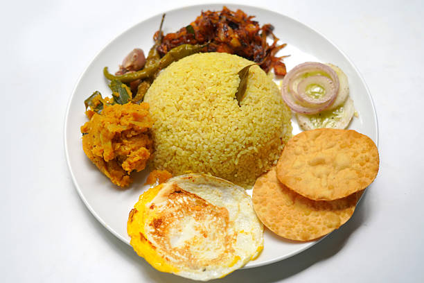 istock Sri Lankan Traditional Rice and Curry Plate with Omelet on White Background. 2234289314