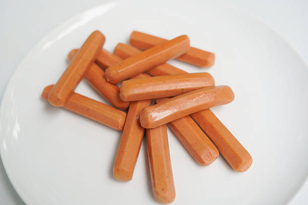 istock Uncooked Sausages on a White Plate. 2234289544
