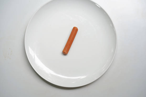 istock White Dish with One Sausage. 2234289550